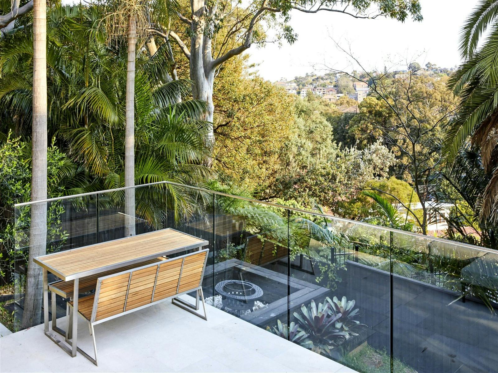 Home with panoramic leafy views and an indoor-outdoor flow designed to enhance its beach location