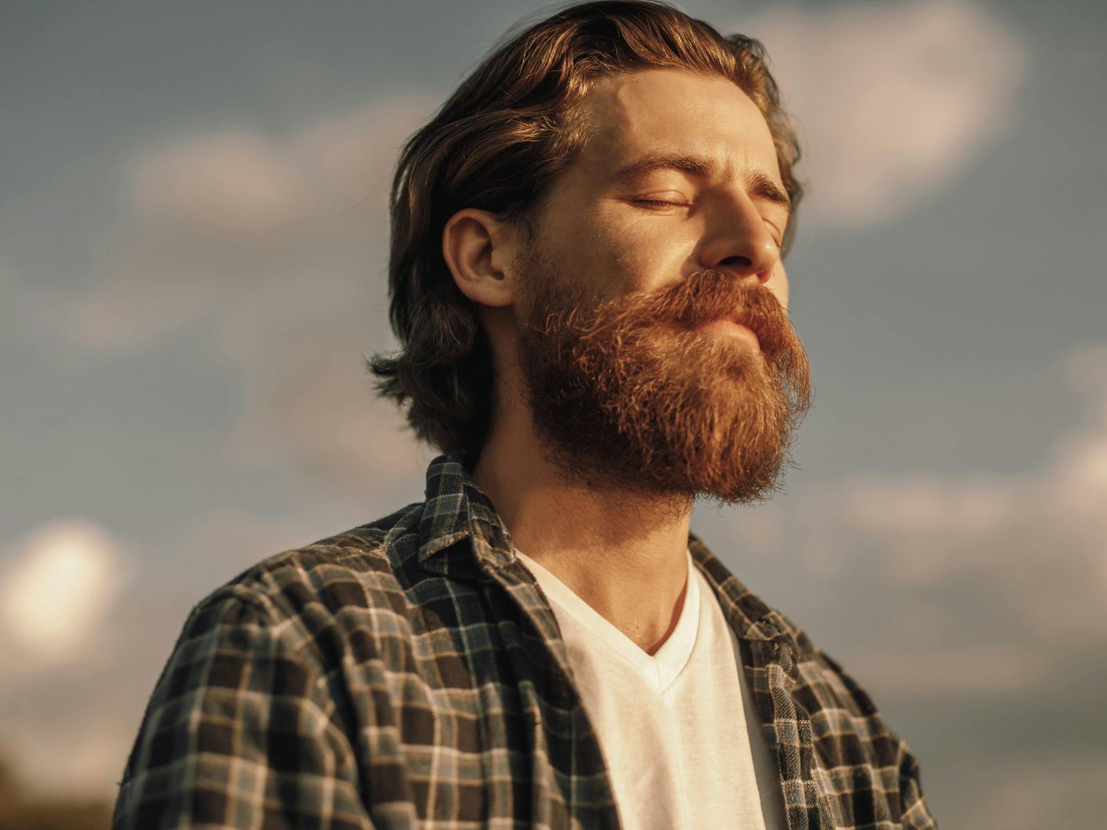 Man meditating with eyes closed