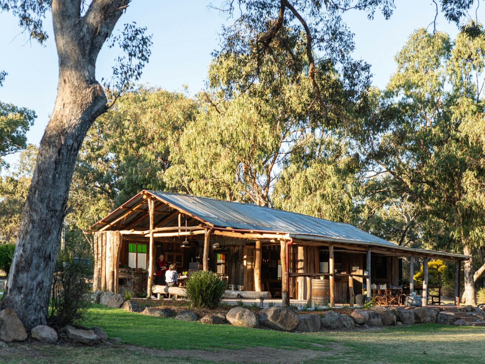 rustic timber hut in bushland settting rustic timber hut in bushland settting