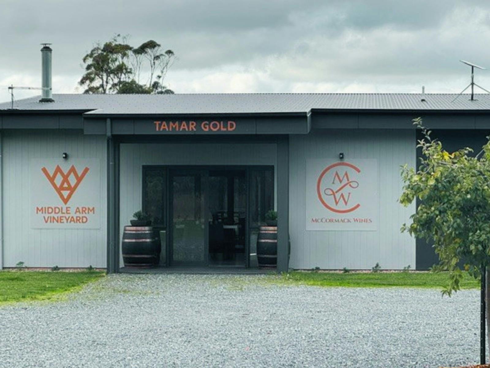 The front of a cellar door with signage saying Tamar Gold, Middle Arm Vineyard and McCormack Wines