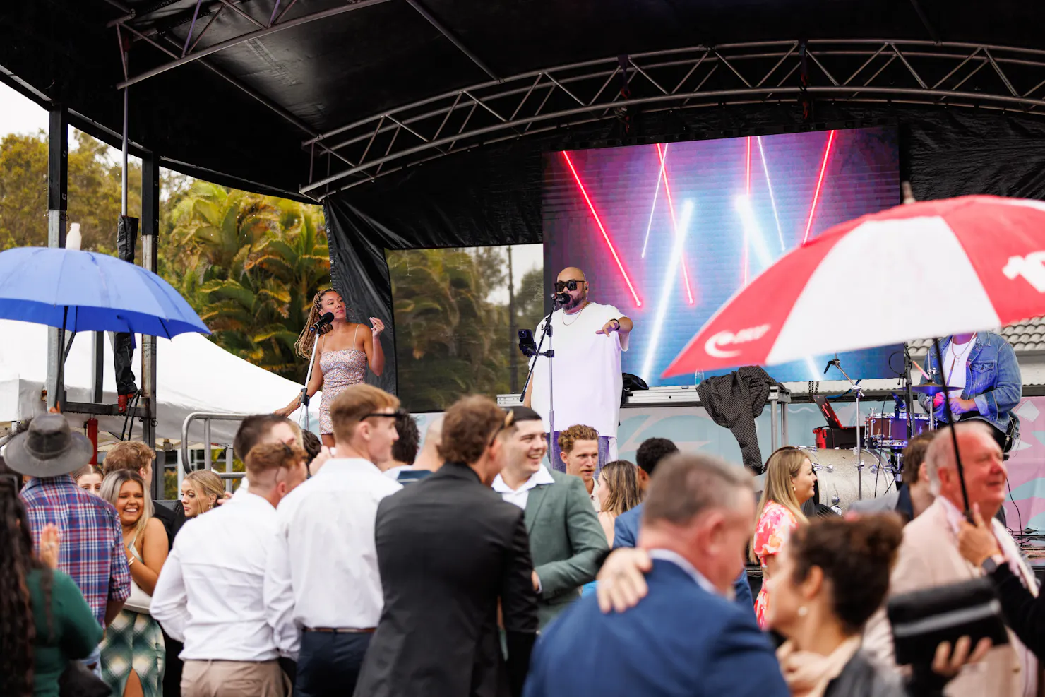 band performing on stage to a crowd