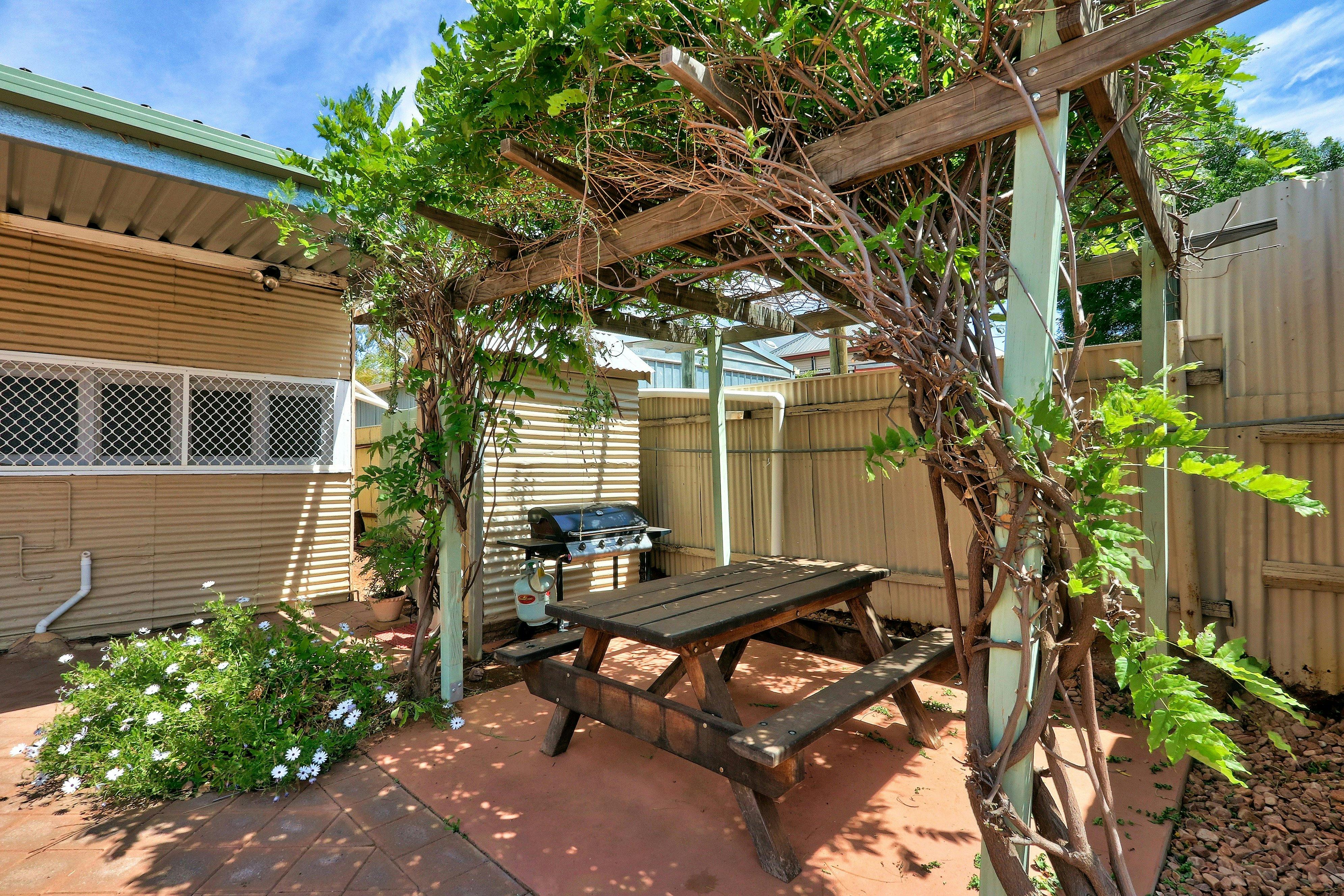 A gas BBQ is provided to enjoy a BBQ meal in the undercover shaded patio area