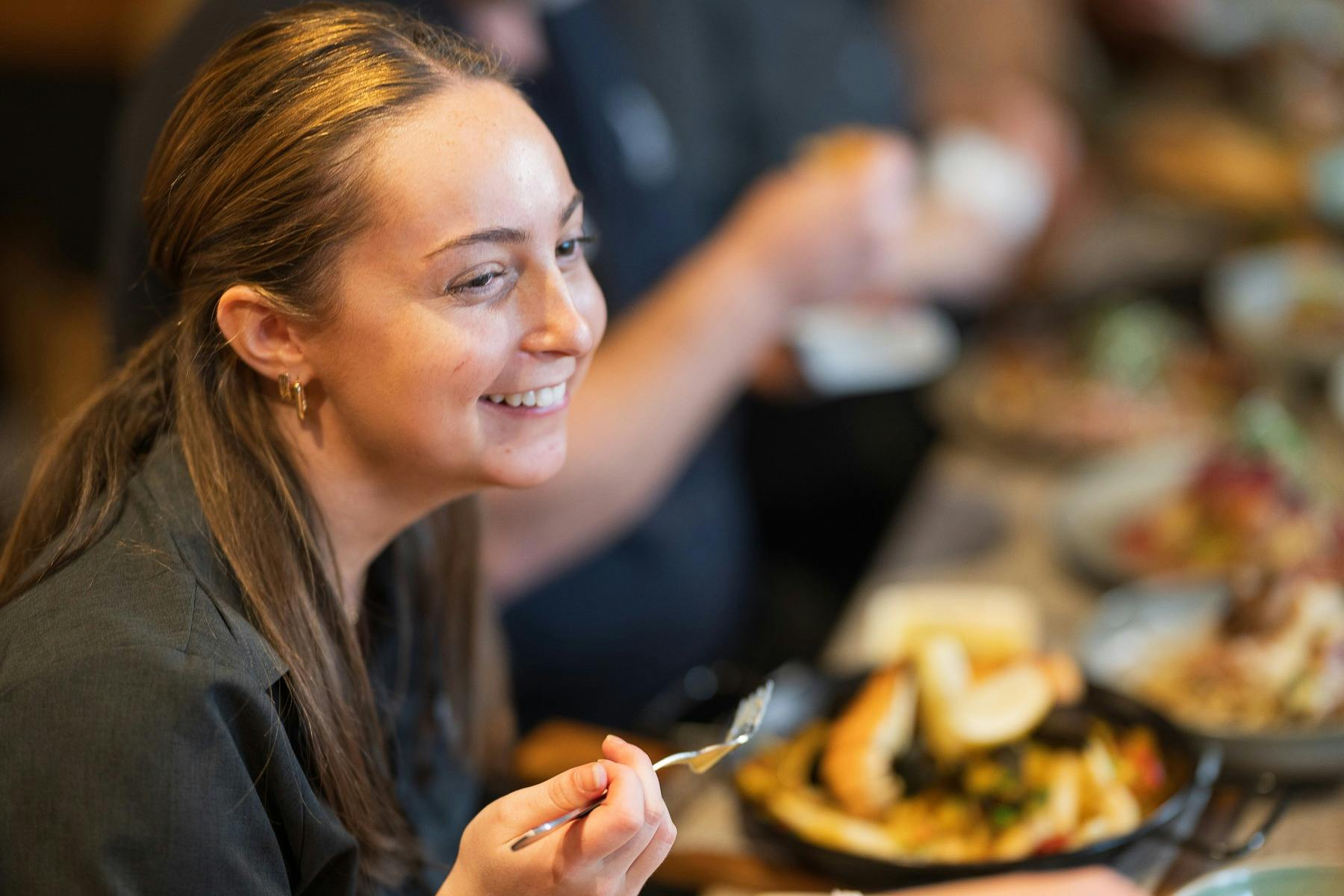 Customer enjoys a meal with friends and family