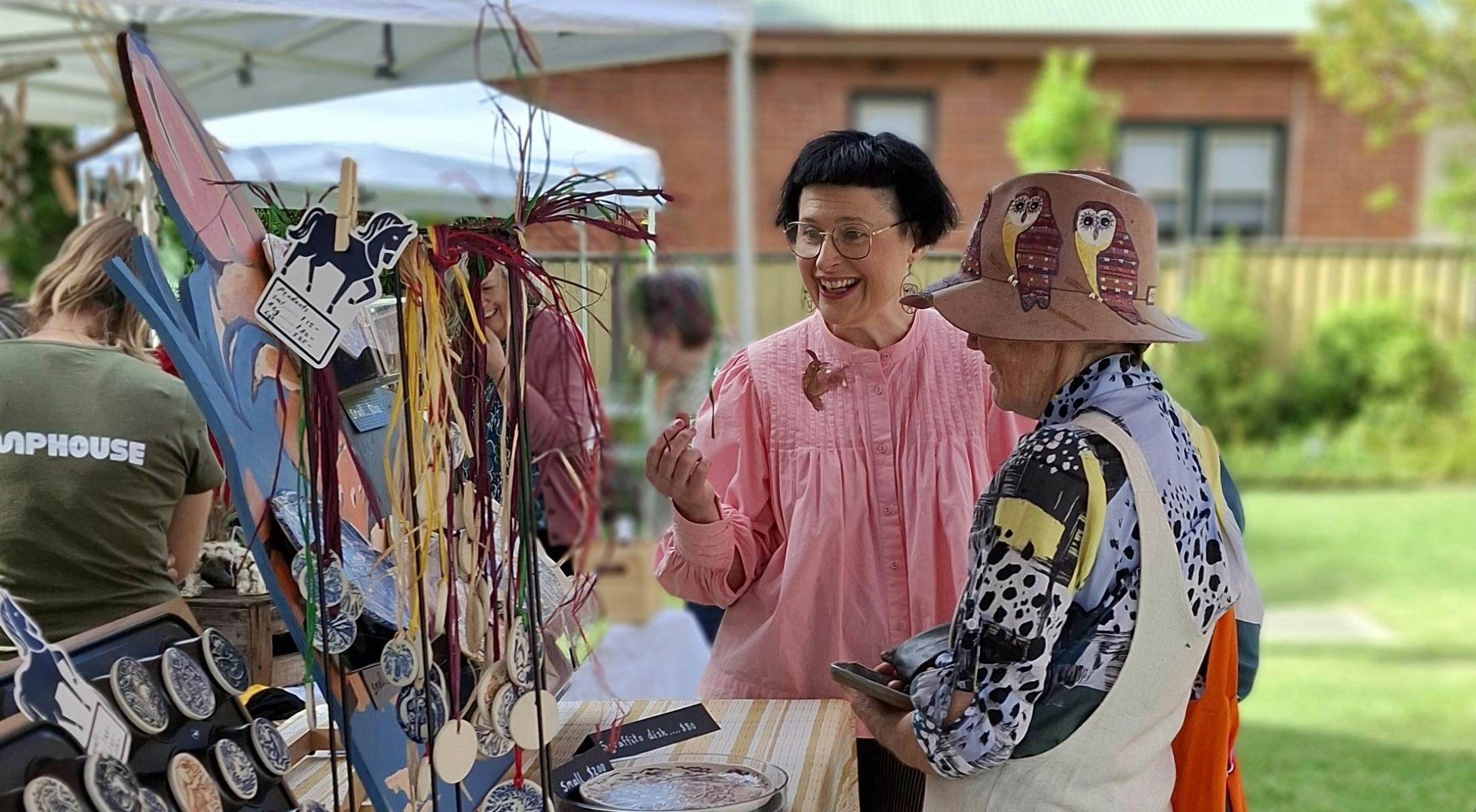 people chatting at the Pumphouse design market