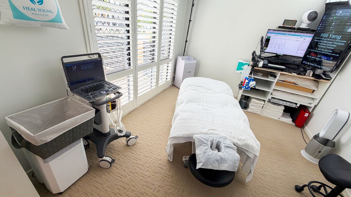 Heal Young Massage treatment room with massage table and diagnostic ultrasound on Gold Coast. Heal Young Massage treatment room with massage table and diagnostic ultrasound on Gold Coast.
