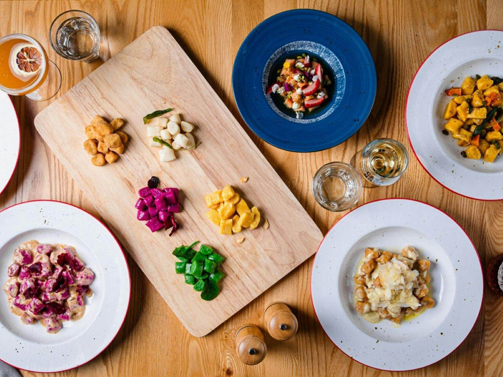 Various dishes plated on table