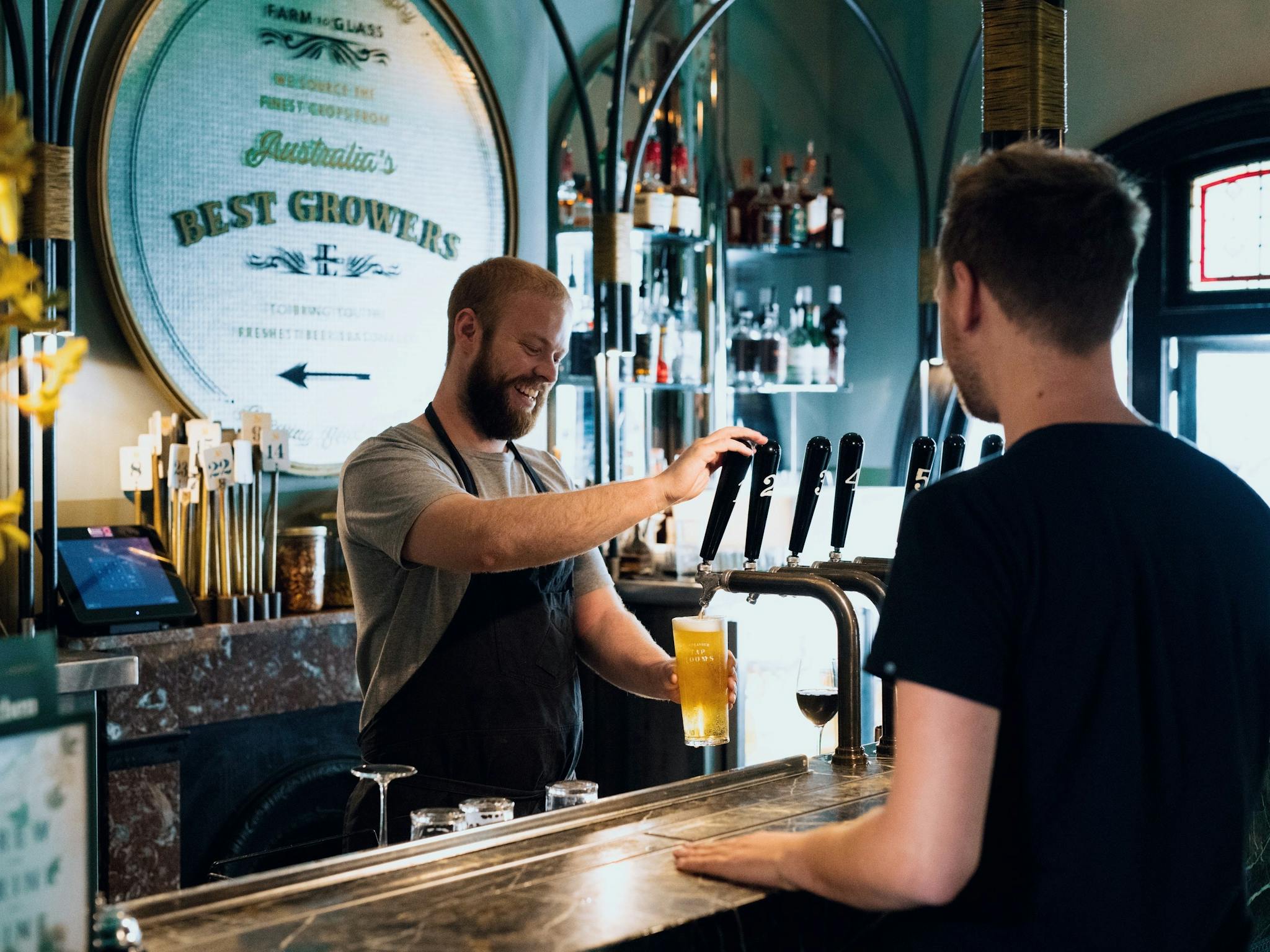 Pouring a cold beer at The Endeavour Tap Rooms in The Rocks.