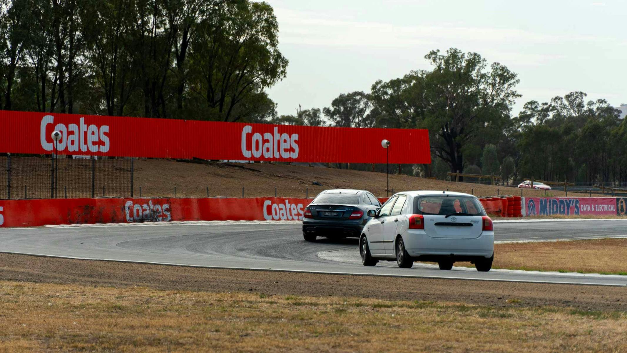 2 cars on a race track