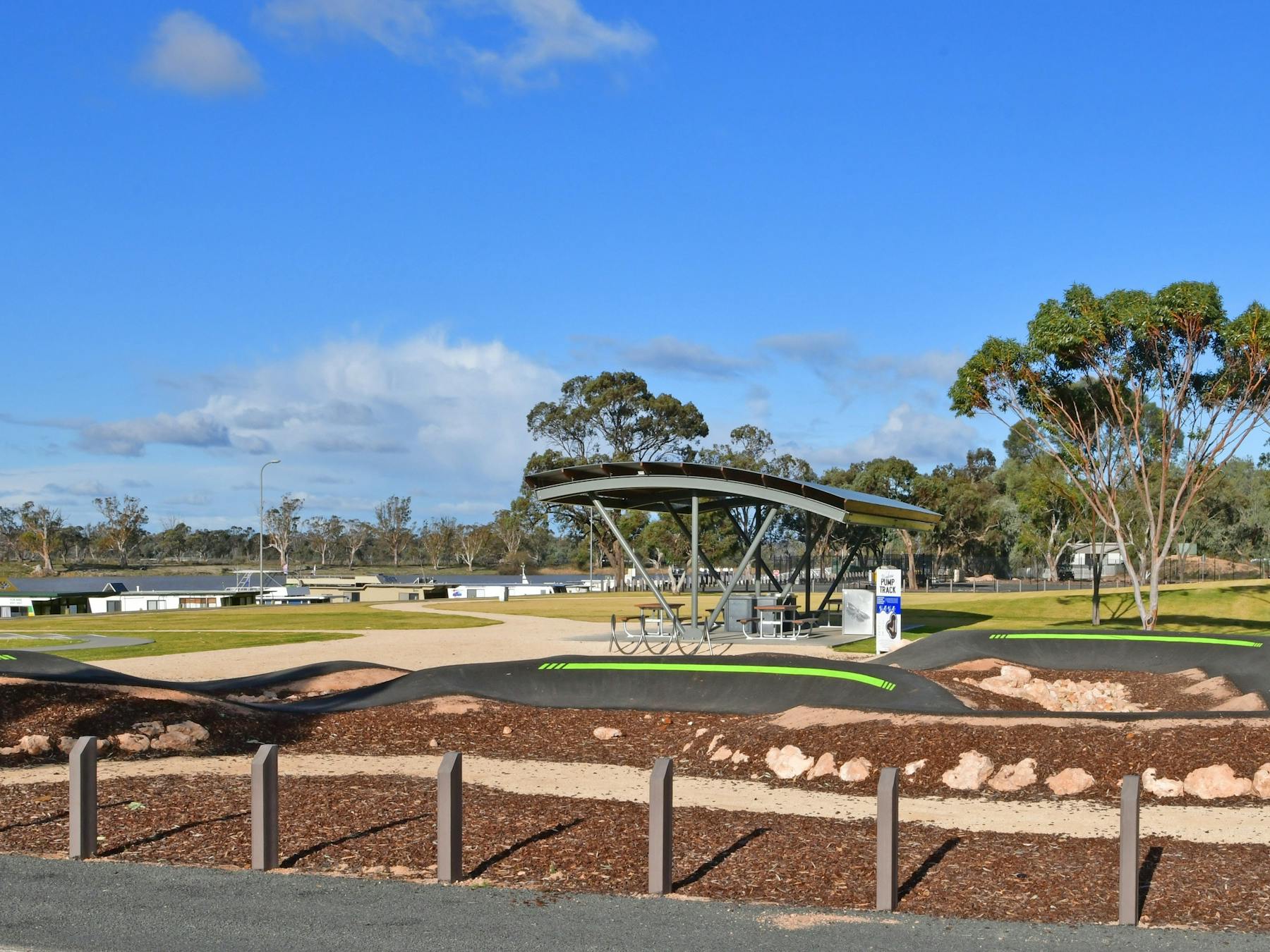 View from carpark of pump track and shelter