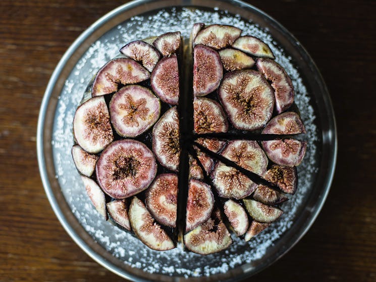 Local fig cake beautifully presented with intricate cross sectioned figs.