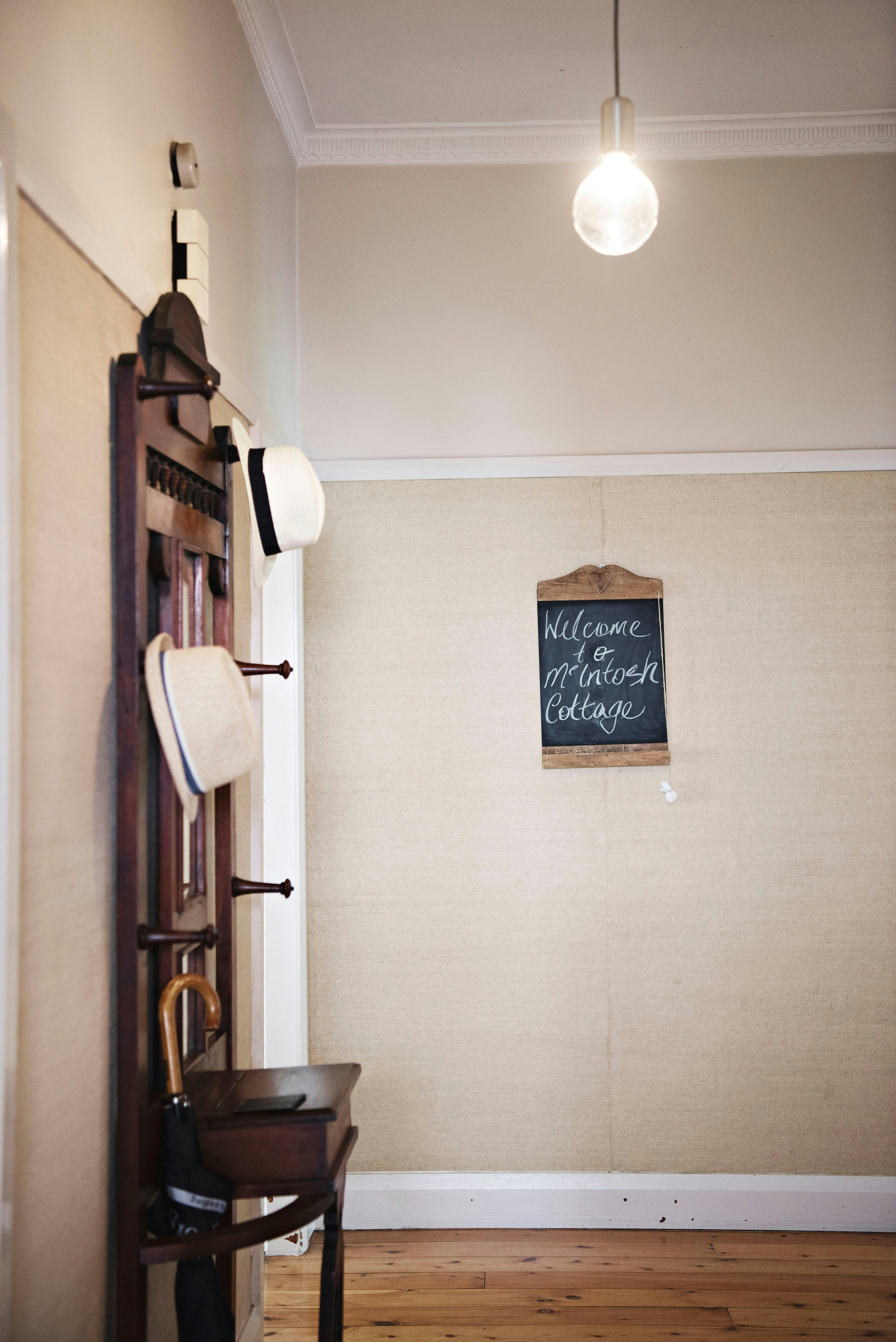 Entry hall into house with hat rack on left