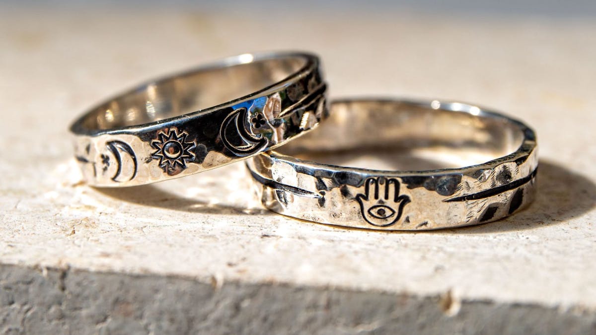A hands-on jewellery workshop where participants create custom hammered silver rings using stamps