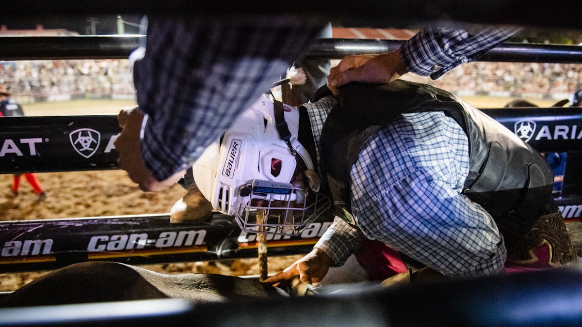 PBR athlete gearing up in chutes PBR athlete gearing up in chutes