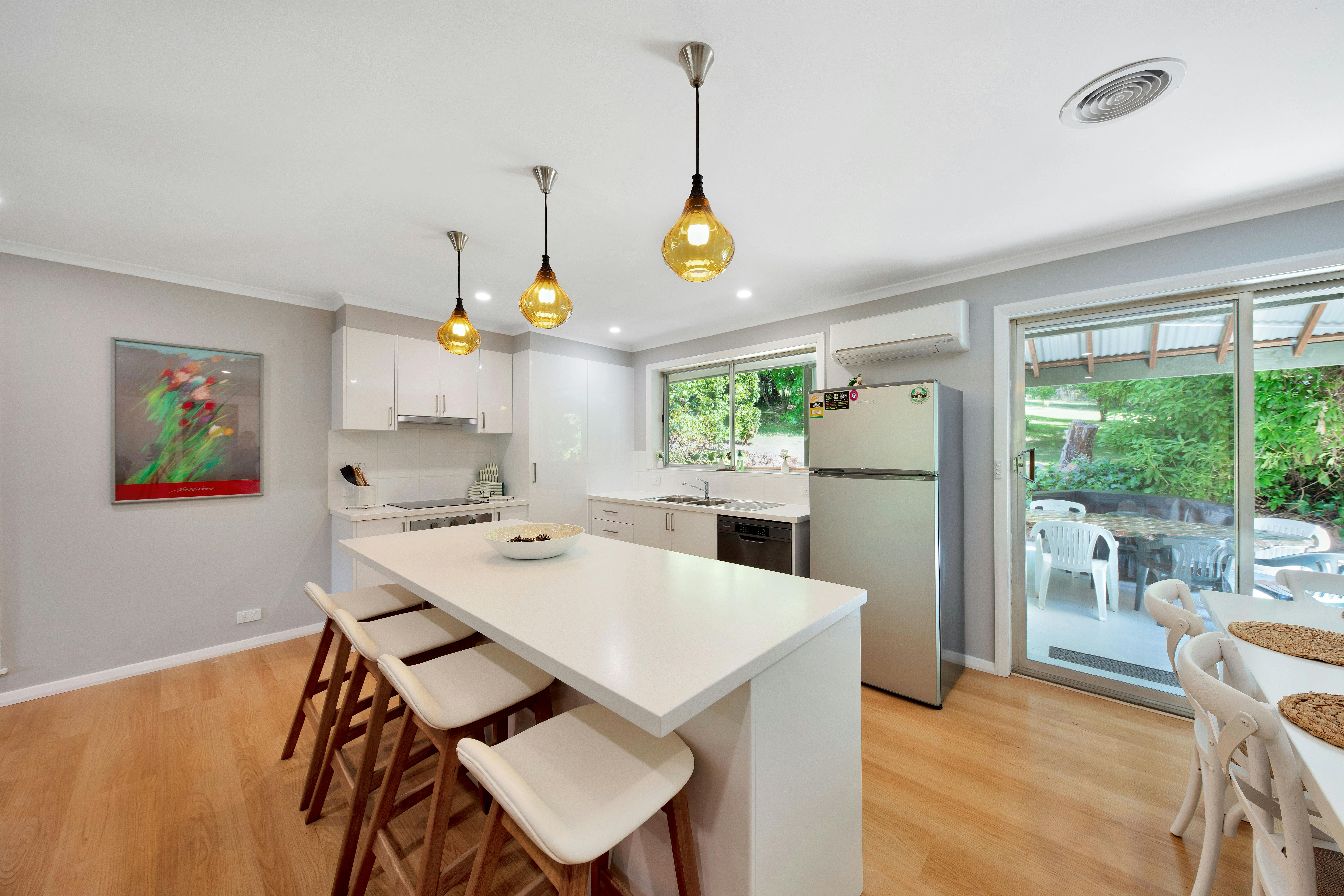 Island bench with stools in kitchen