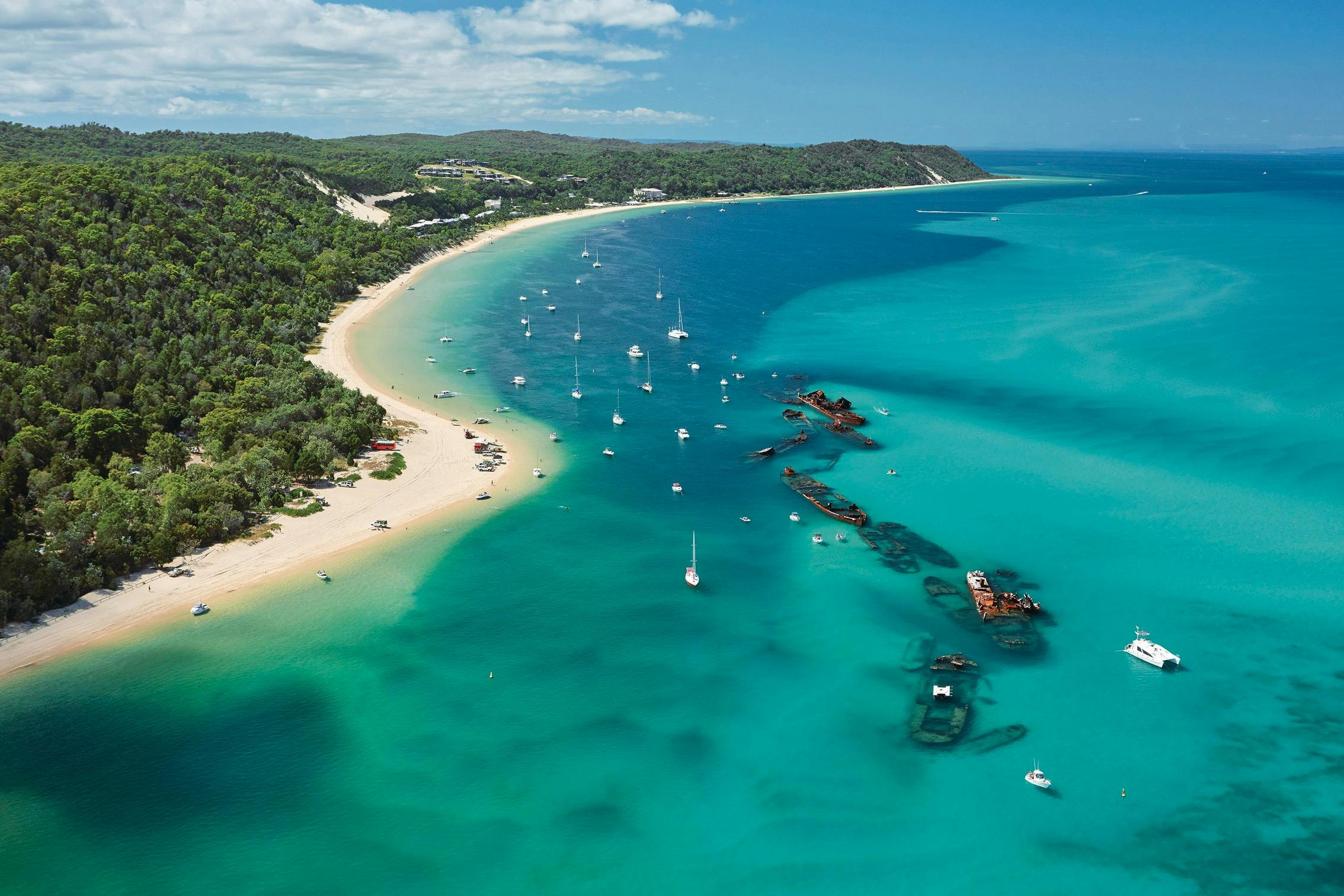 Drone shot of the Tangalooma Wrecks with aqua water