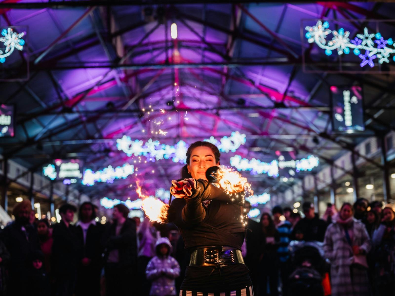 Fire twirling performer at Winter Night Market