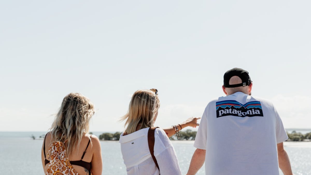 Passengers enjoying the view from the viewing deck of a ferry