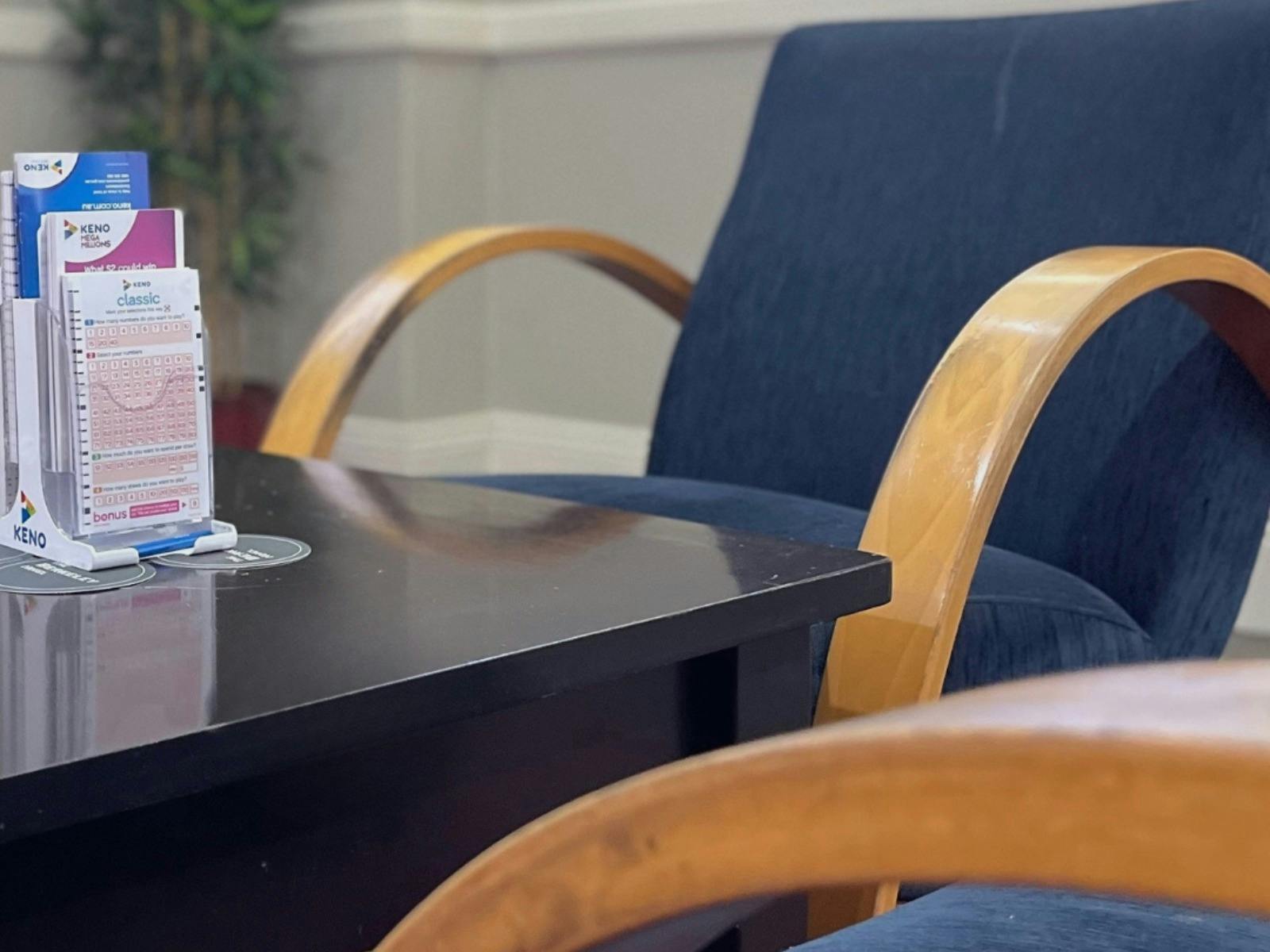 chairs and table at Berkeley Hotel with KENO papers on the table