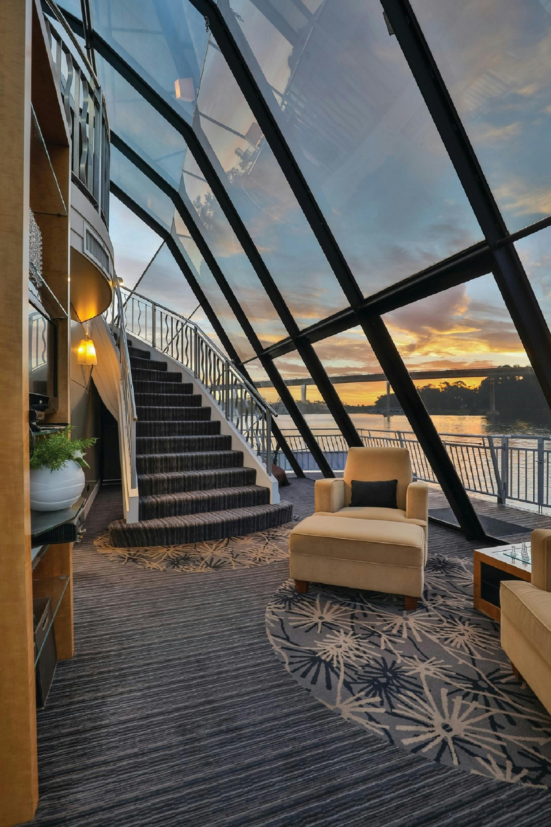 a sweeping staircase inside a riverboat