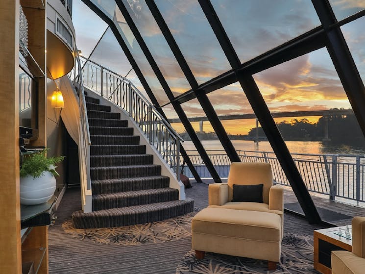 a sweeping staircase inside a riverboat
