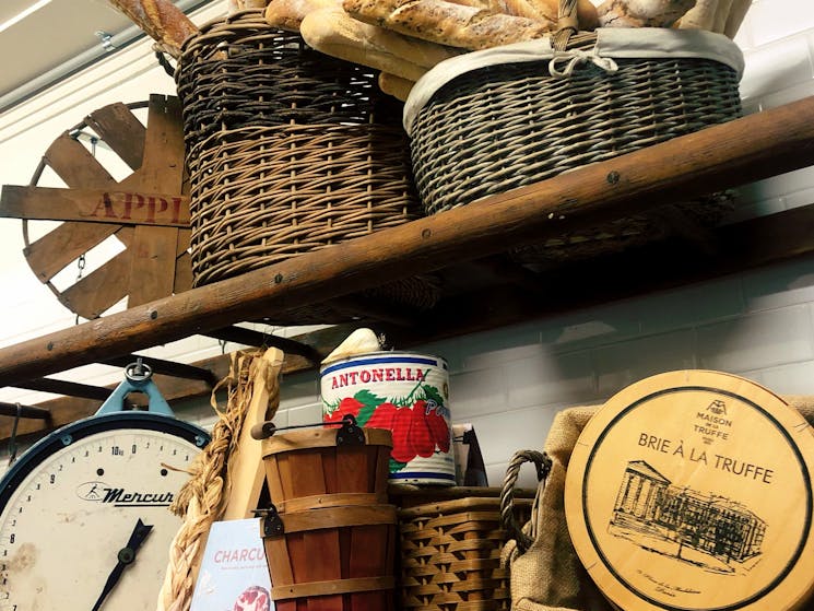 french farmland decorations. Baguettes, cheese box, canned tomato, old fruit market scales, baskets