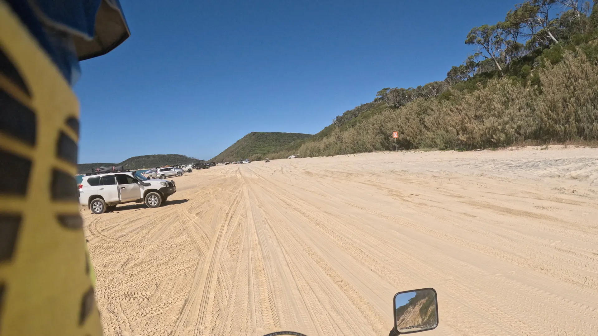 POV view riding a dirt bike on the beach