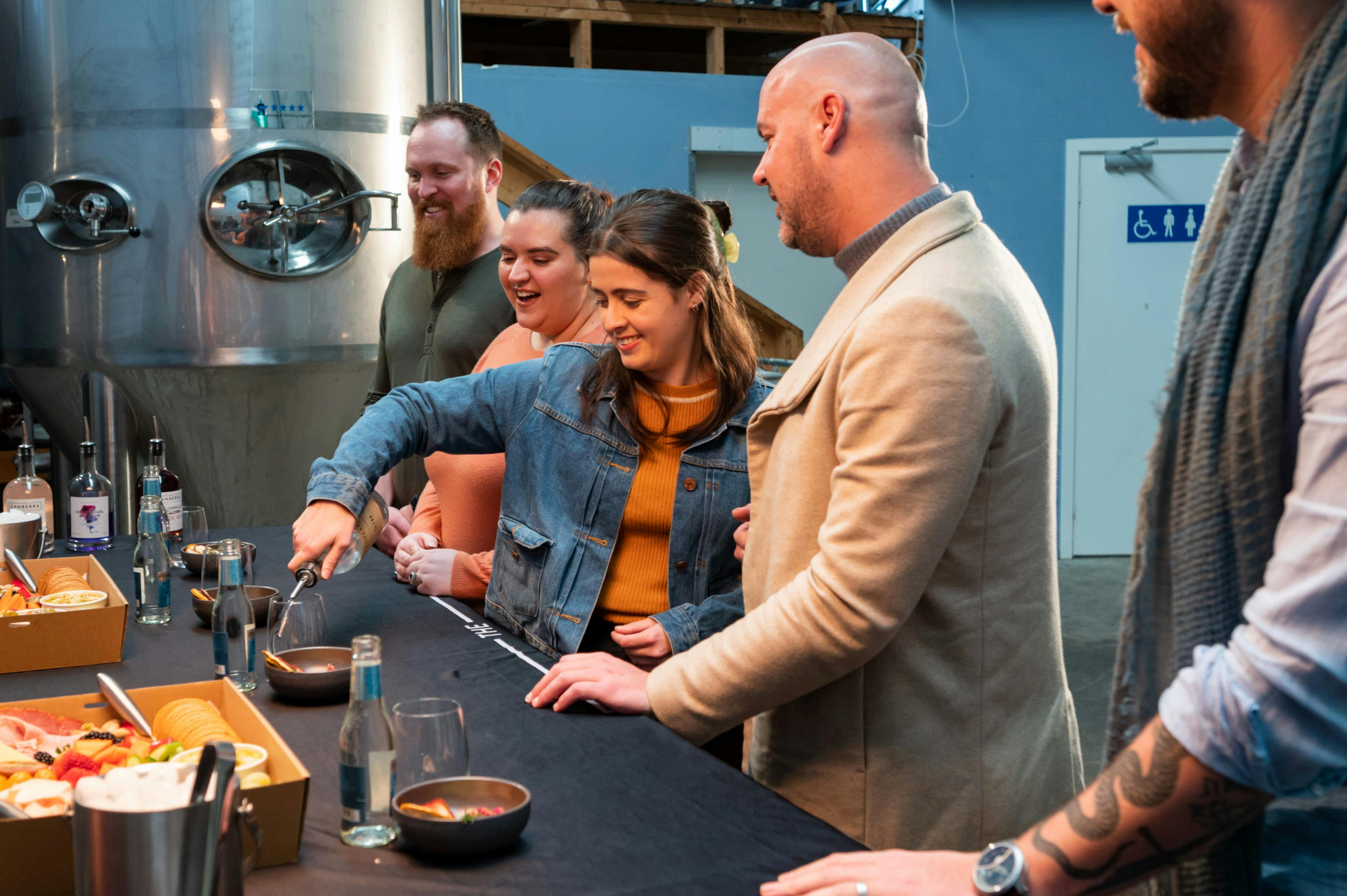 Guests do a tasting in the distillery