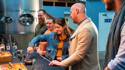 Guests do a tasting in the distillery