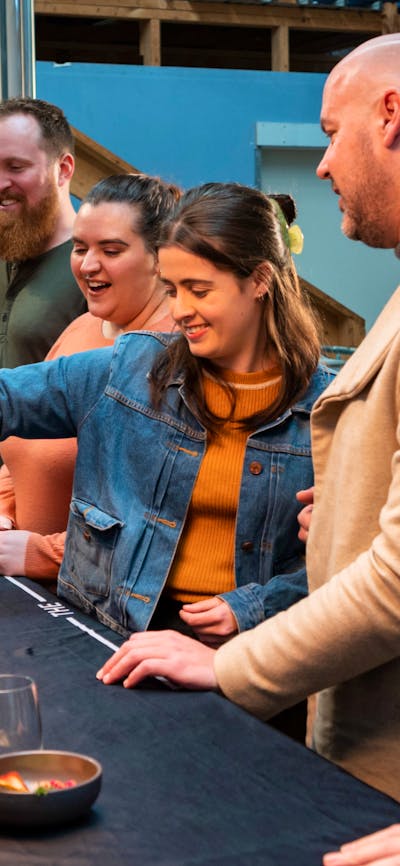 Guests do a tasting in the distillery