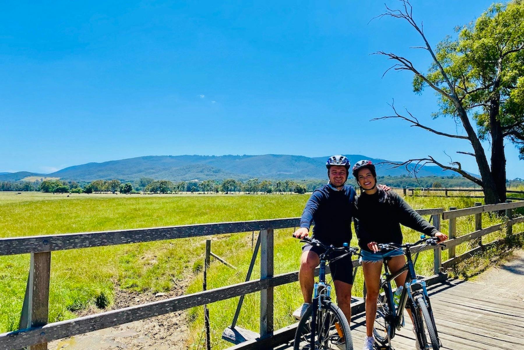 cycling on the warburton rail trail with the yarra ranges national park in the background
