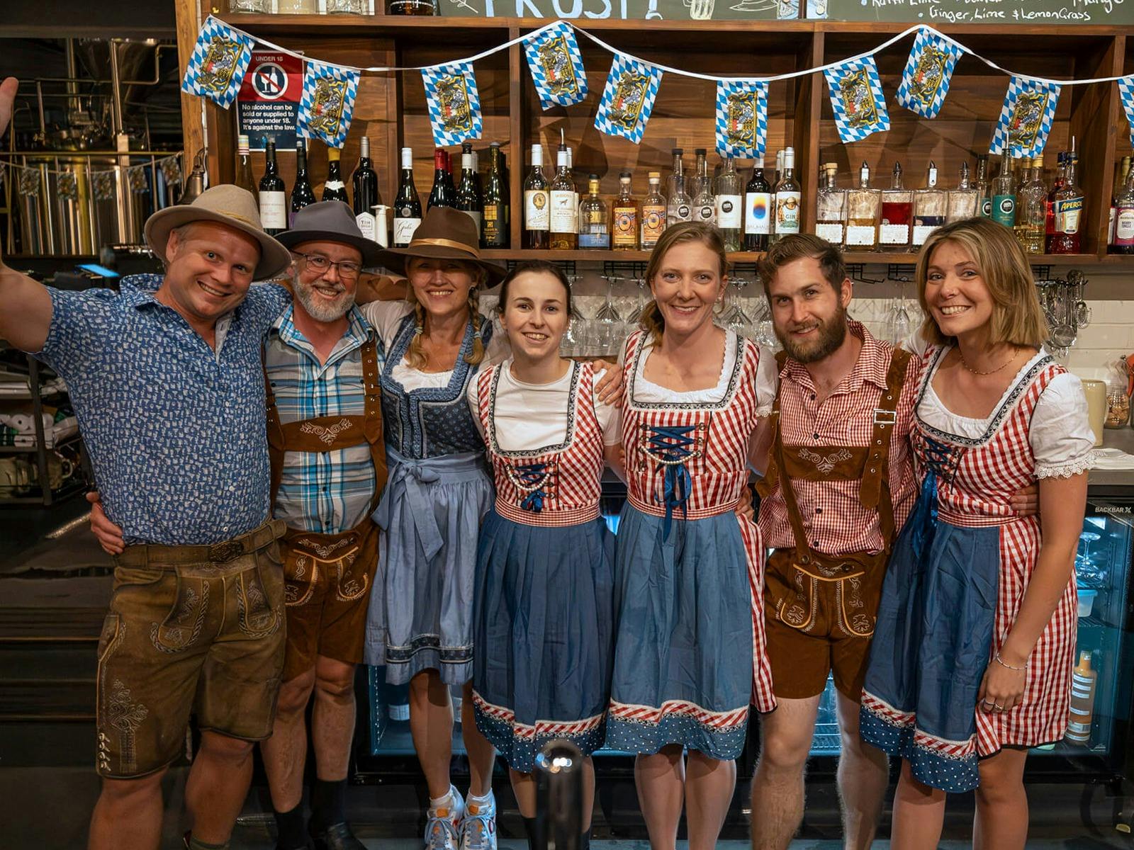 King Tide Staff dressed in full Oktoberfest outfits