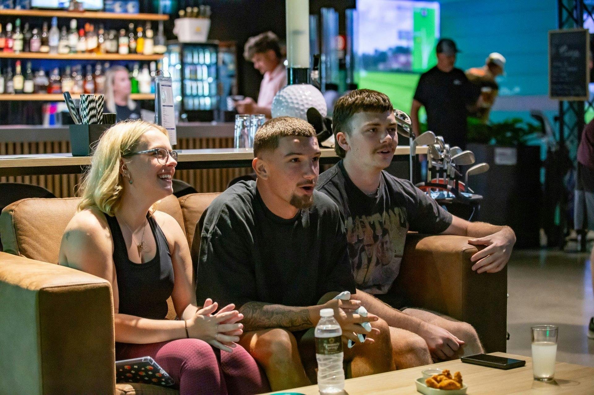 Friends enjoying a night out at X-Golf Penrith