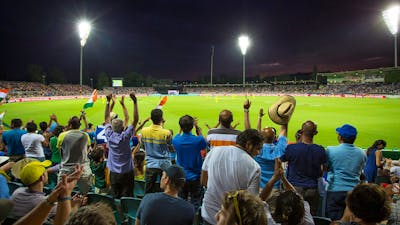 Cricket match under the lights at Manuka Oval