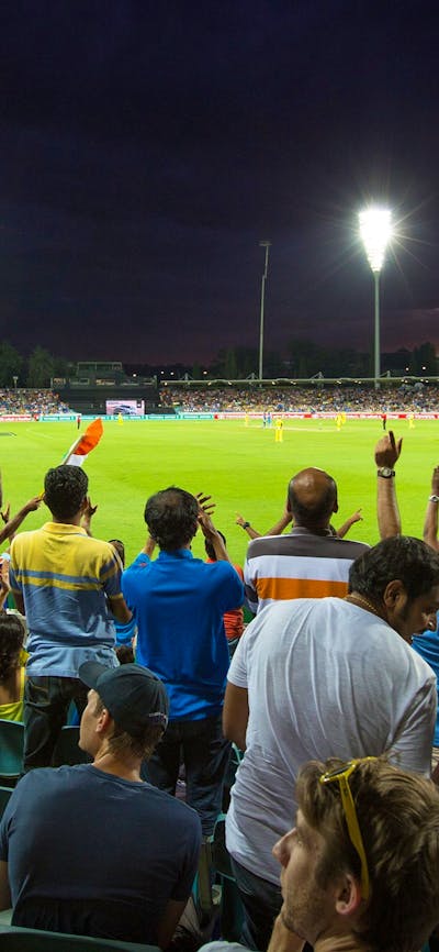 Cricket match under the lights at Manuka Oval
