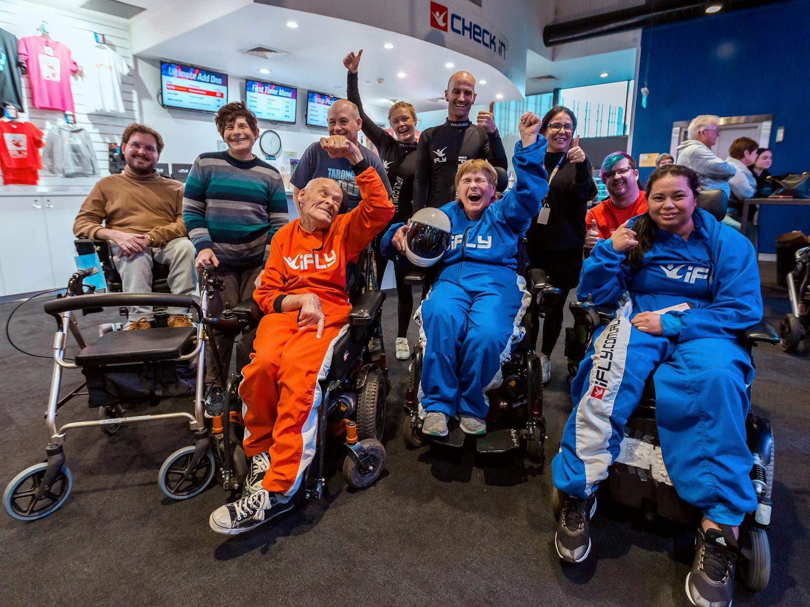 All Abilities Group in suits giving a cheer!