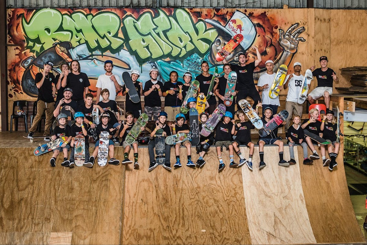 Adult and child skateboarders on a skateboard ramp