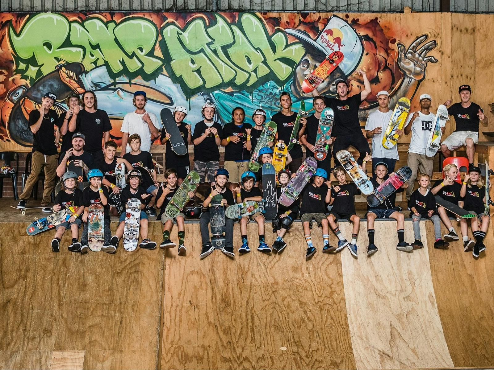 Adult and child skateboarders on a skateboard ramp Adult and child skateboarders on a skateboard ramp