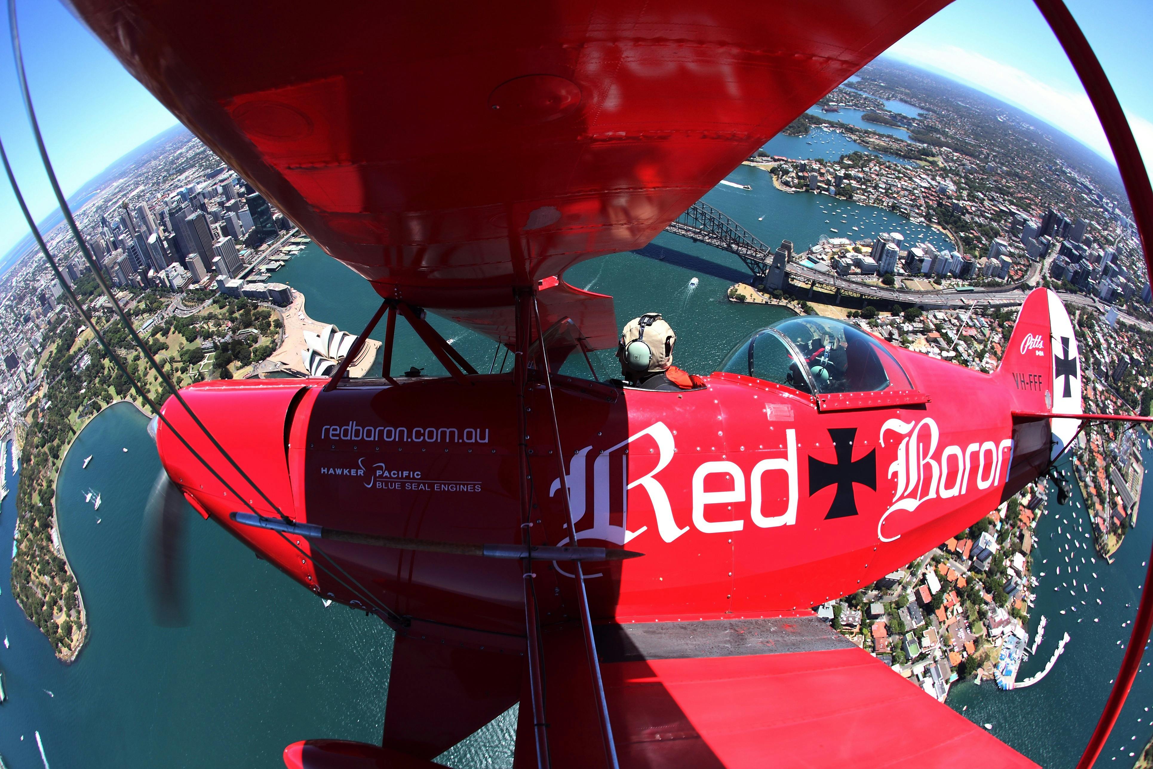 Red Baron biplane over Sydney Harbour