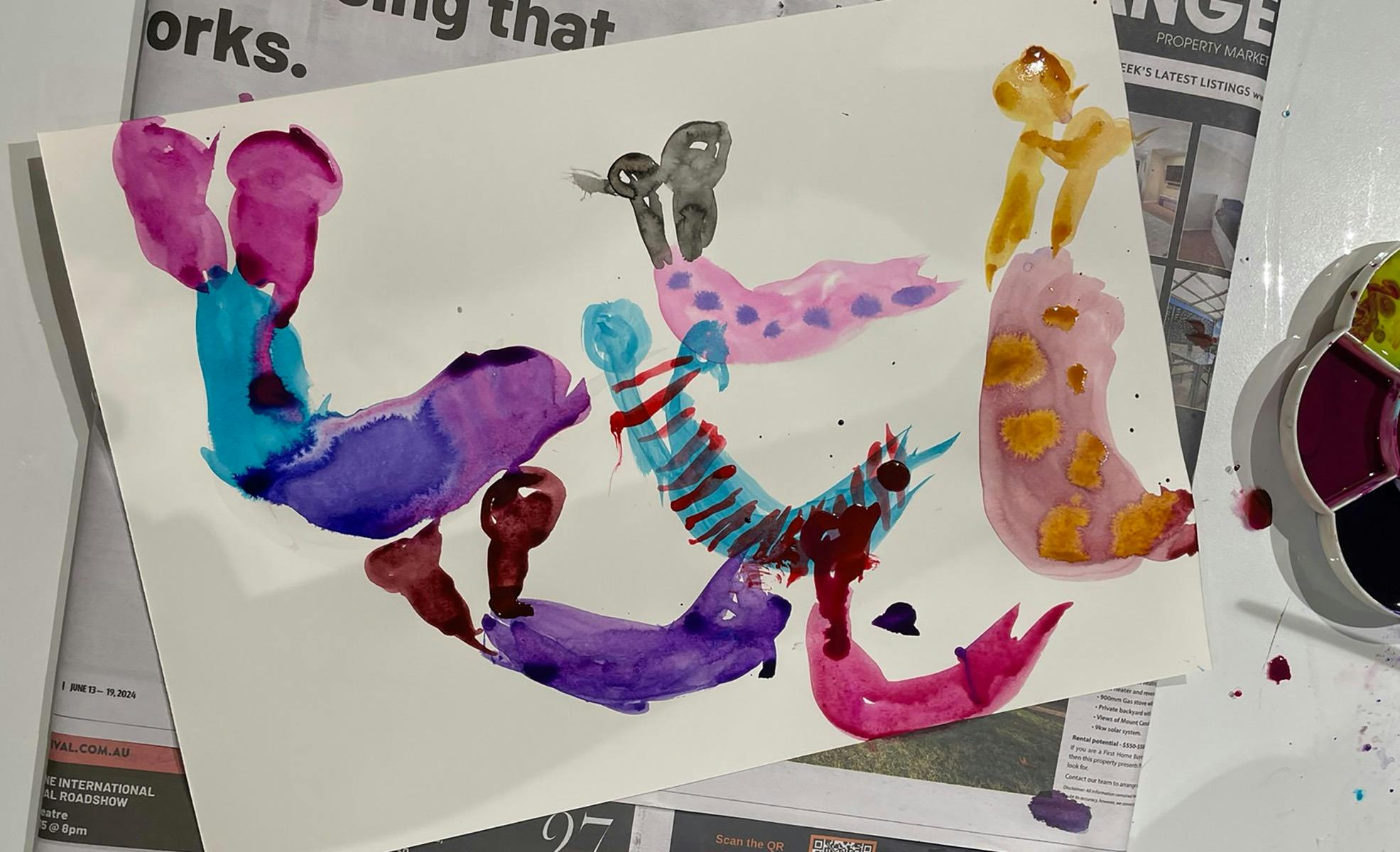 Colourful slugs made in drawing ink by a child
