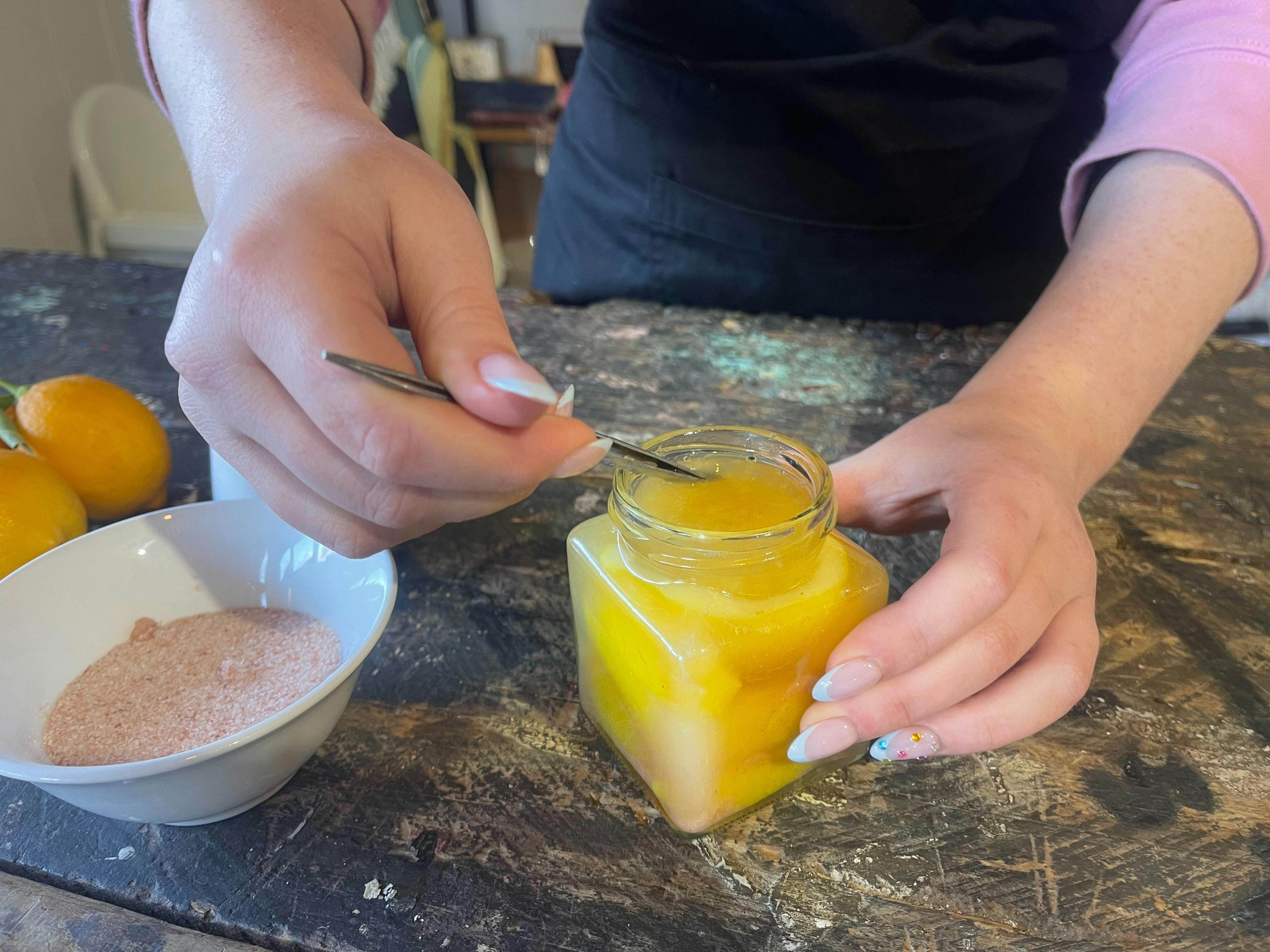 pushing lemons down to squeeze out bubbles