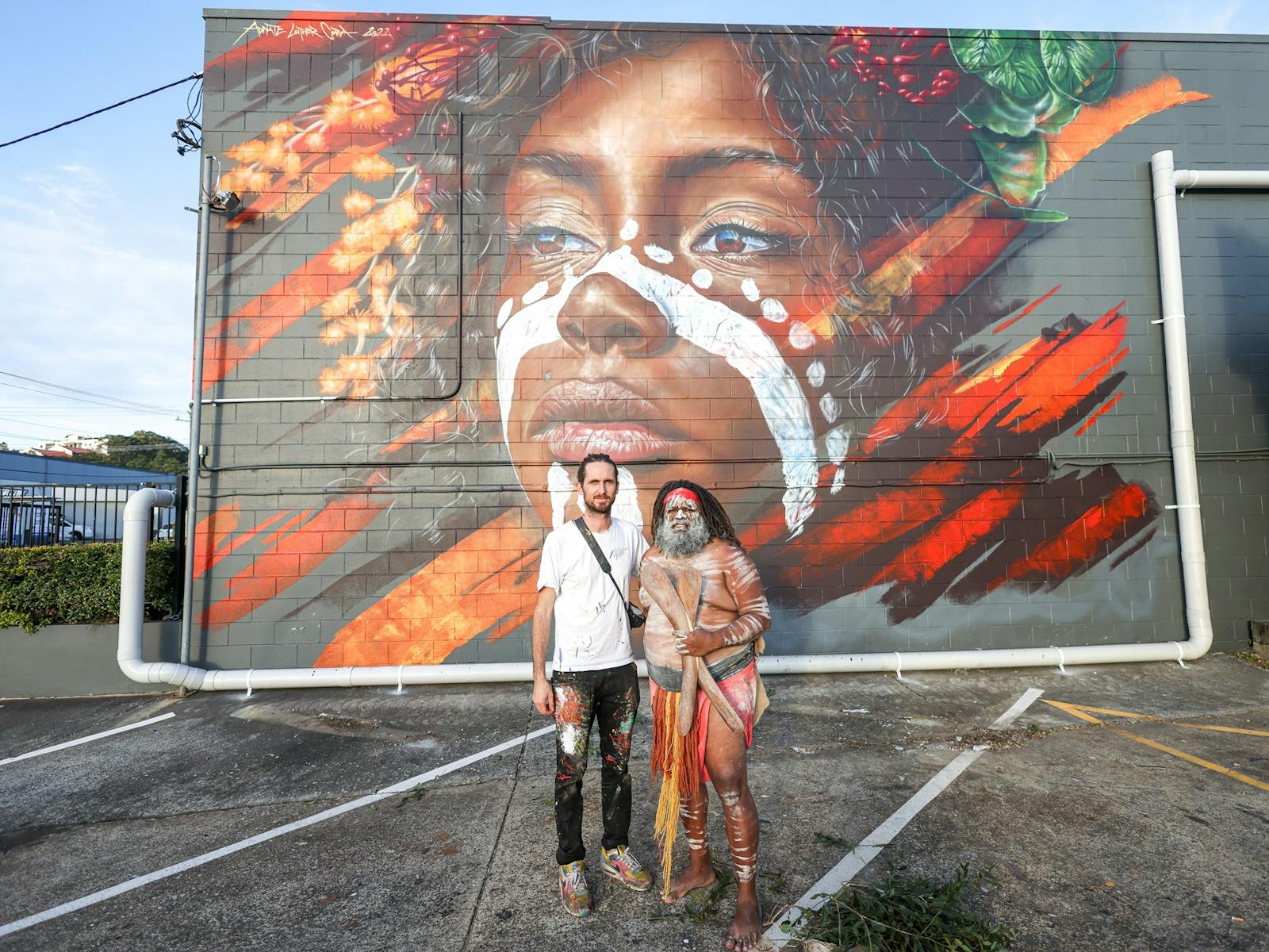 Mural painted by Adnate in collaboration with Luther Cora, a Yugambeh photographer. Mural painted by Adnate in collaboration with Luther Cora, a Yugambeh photographer.