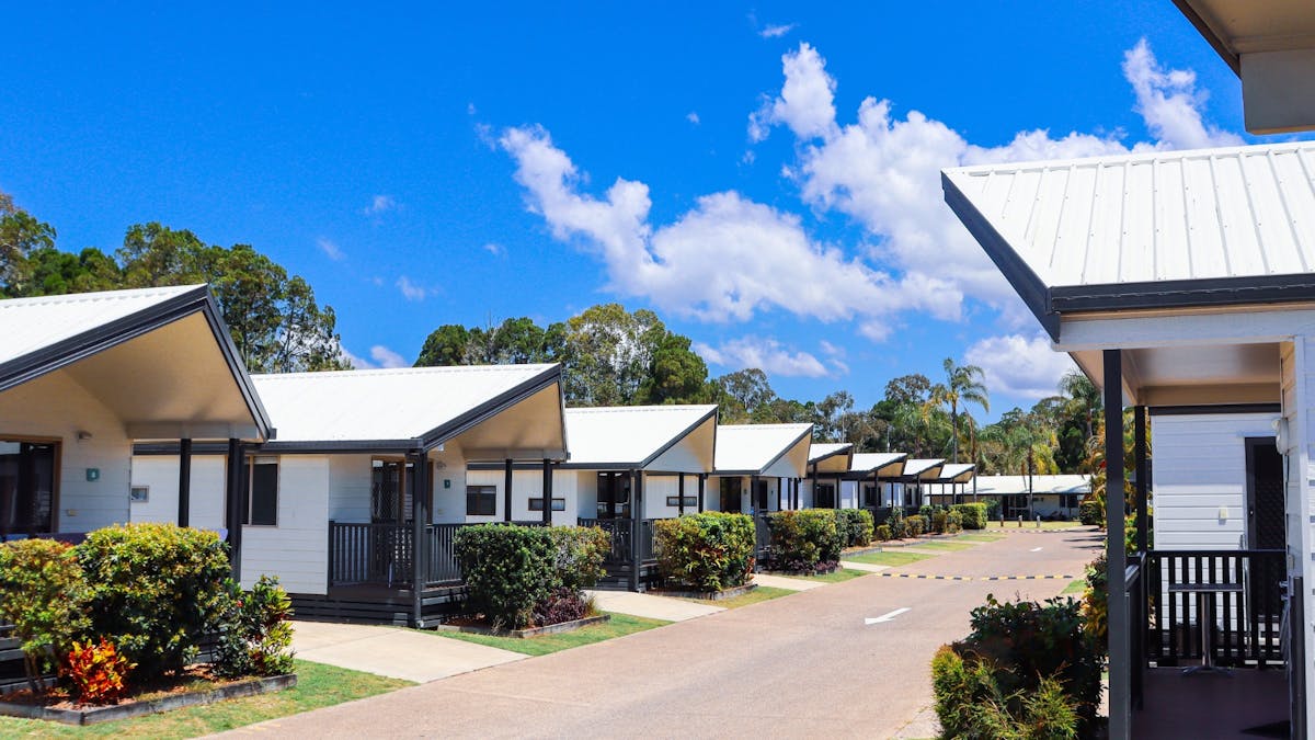 Rainbow Beach cabins on a blue sky day
