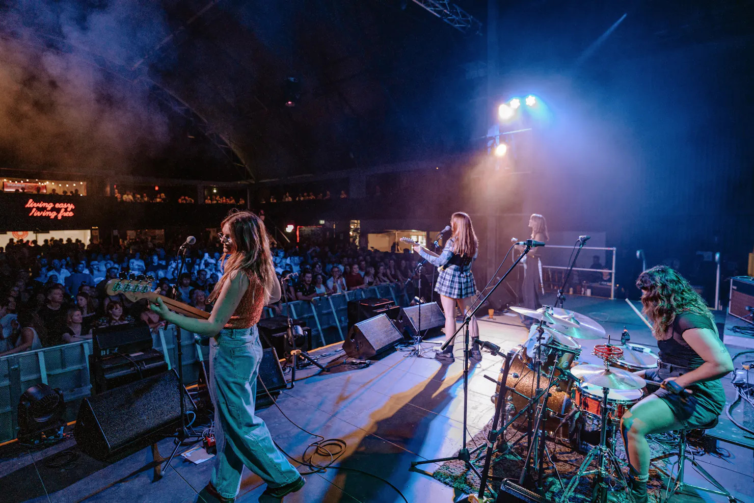 Band plays on a stage to audience