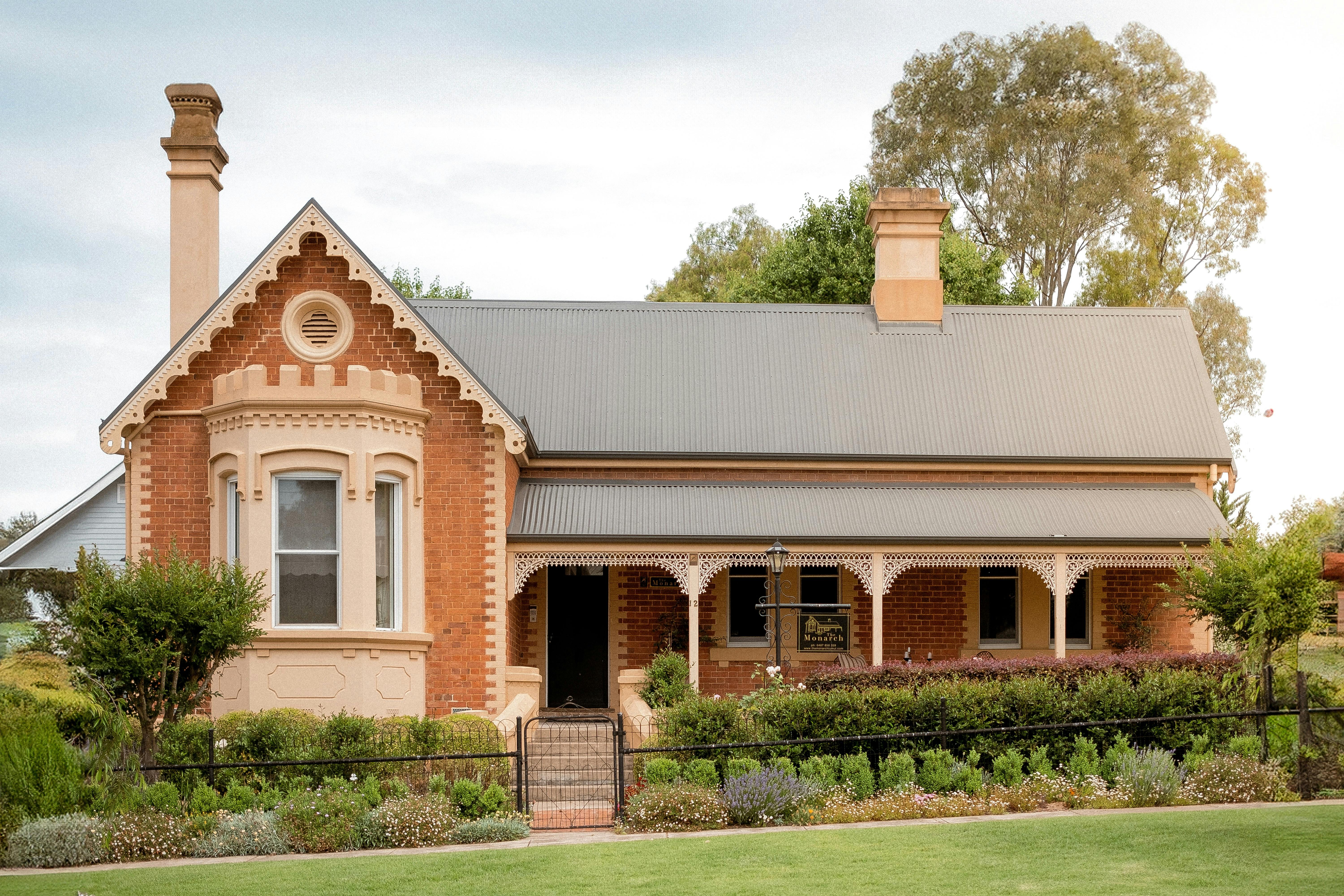 Heritage listed brick home with a cottage garden