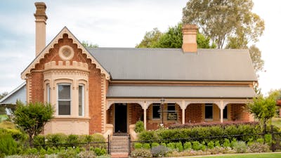 Heritage listed brick home with a cottage garden