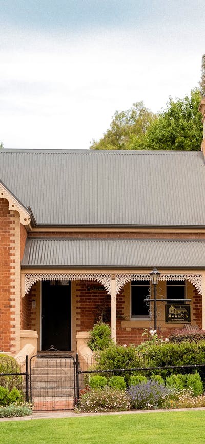 Heritage listed brick home with a cottage garden