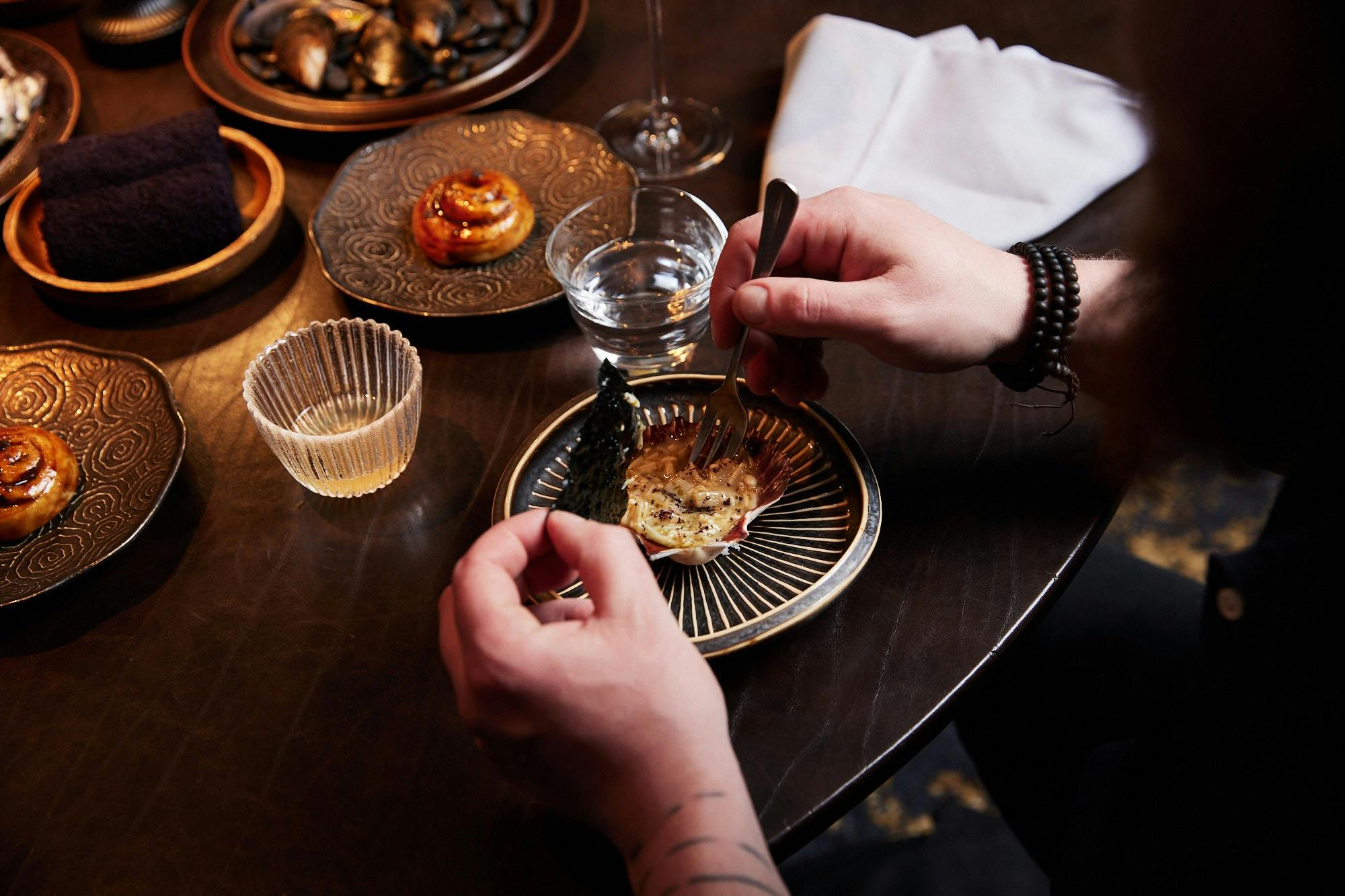 Image of a guest enjoying a dining experience at Ides
