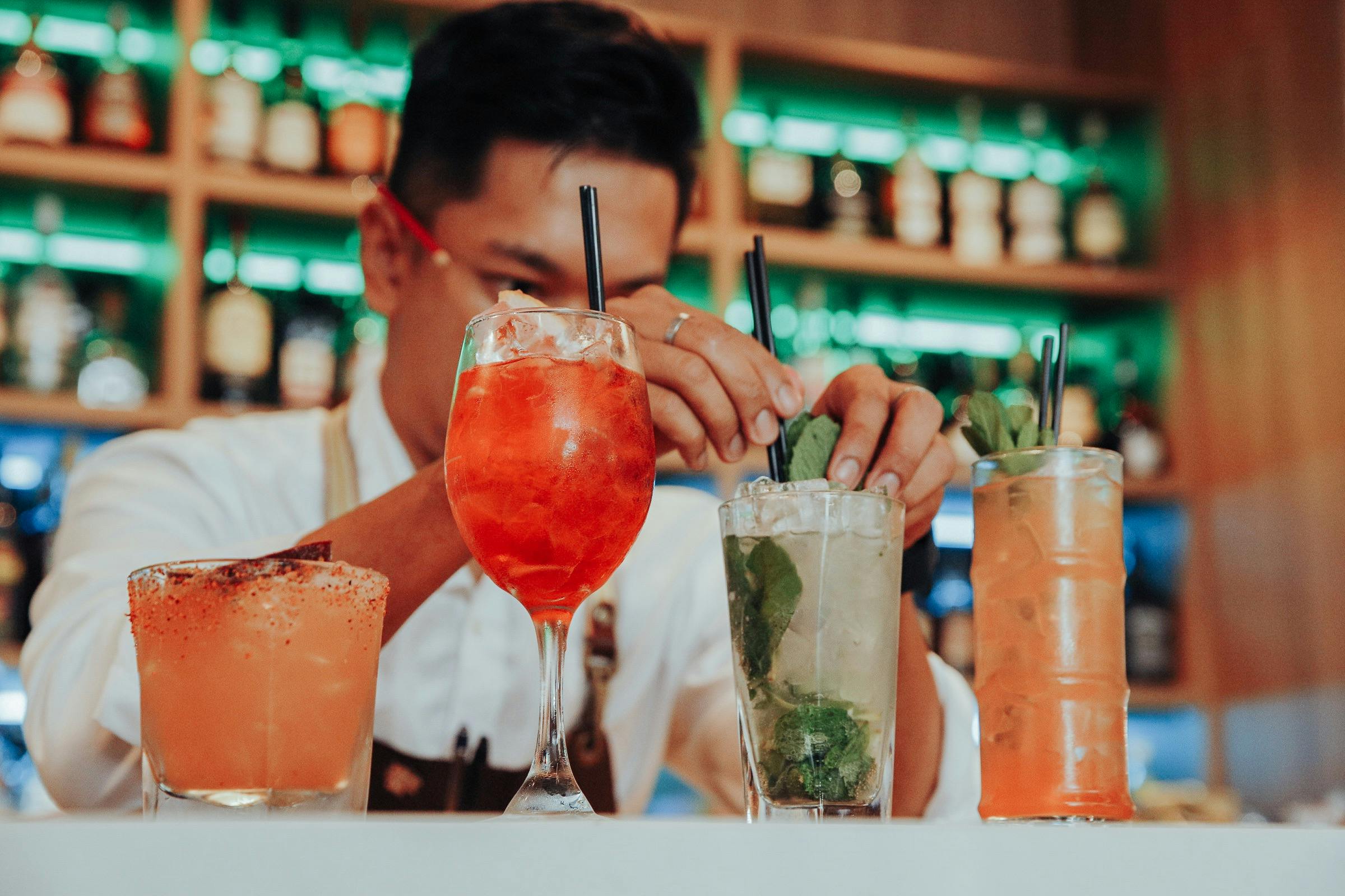 Man preparing cocktails.