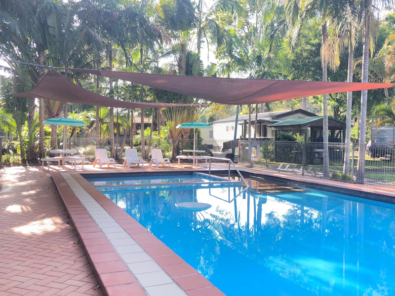 Pool with cabins and garden view
