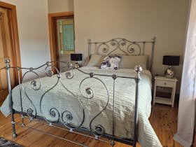 Main bedroom with cast iron queen bed